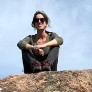 Helena Valverde Iglesias sitting on a rock