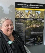 Kathy Potter standing beside her research poster